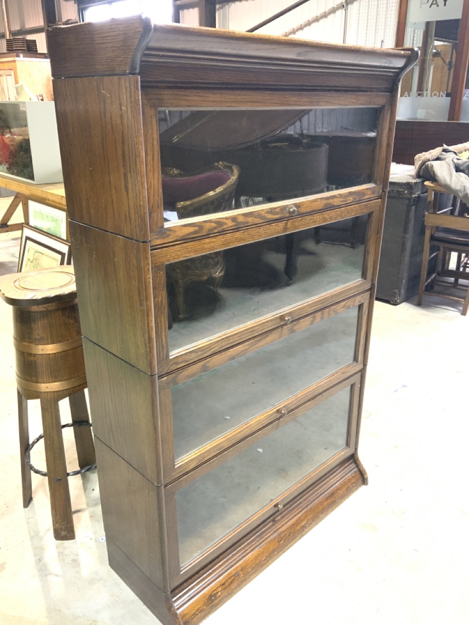 An oak four section Globe Wernicke style book case. No labels. W:88cm x D:34cm x H:142cm