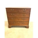 A Georgian style oak chest of drawers with brass handles with original back boards. W:104cm x D:51cm