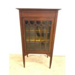 An inlaid Edwardian music cabinet with fret carved glazed to two interior lined shelves. W:58cm x