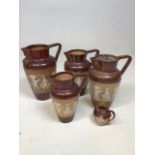 A set of Doulton Lambeth Egyptian revival jugs H:23cm Tallest