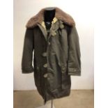 A vintage Swedish military canvas and sheepskin overcoat.