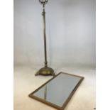 A brass adjustable standard lamp base with a bevel edge mirror in gold frame H:119cm