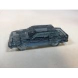 A glass paperweight of a Volvo 760 GLE, limited edition by Reijmre. Un-boxed W:8cm x D:19cm x H:6cm