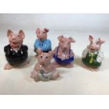 A set of five Nat West pig money boxes by Wade