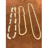 Three pearl necklaces.