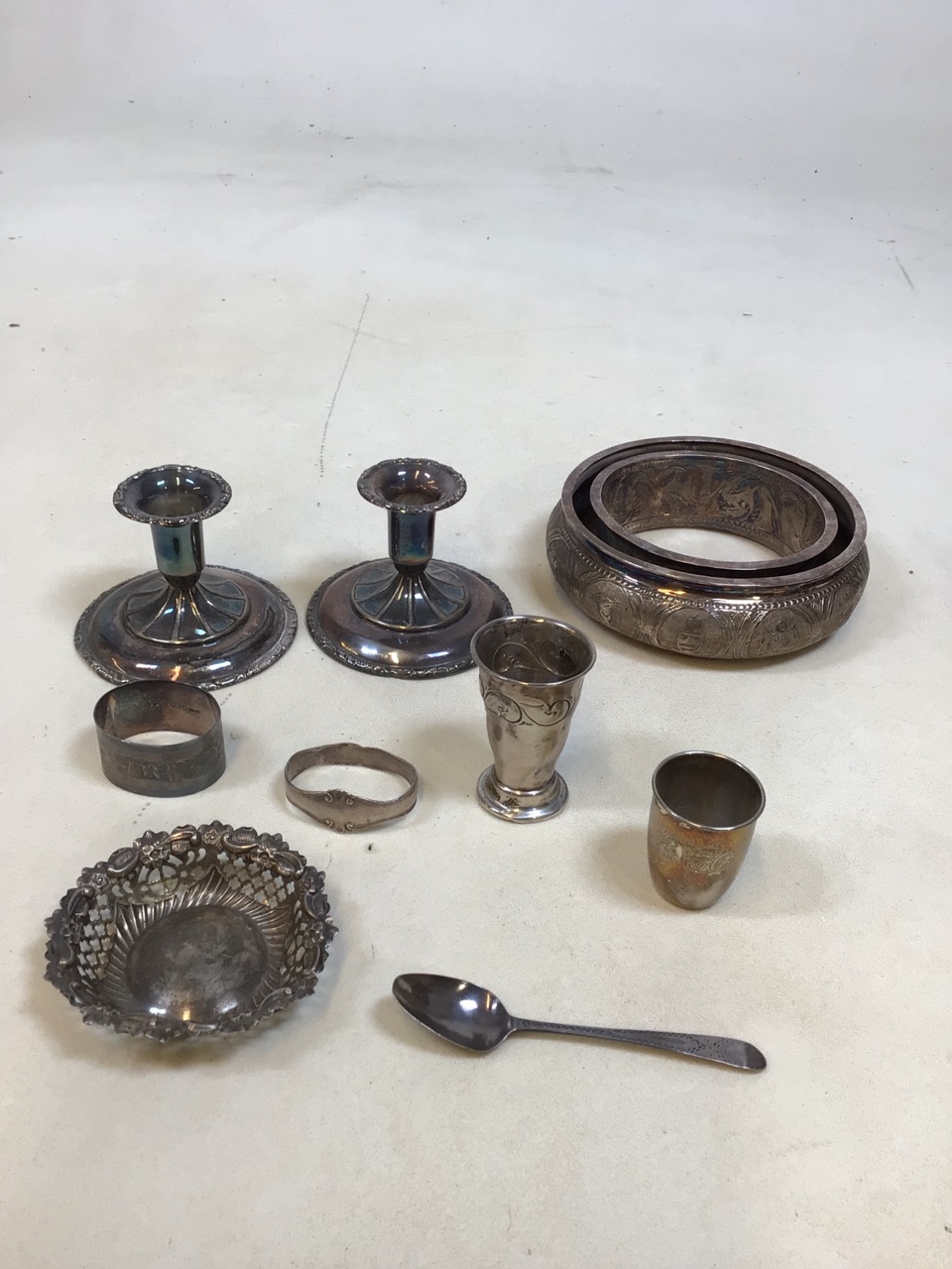 A quantity of Norwegian Silver including weighted candlesticks and a white metal ring marked with