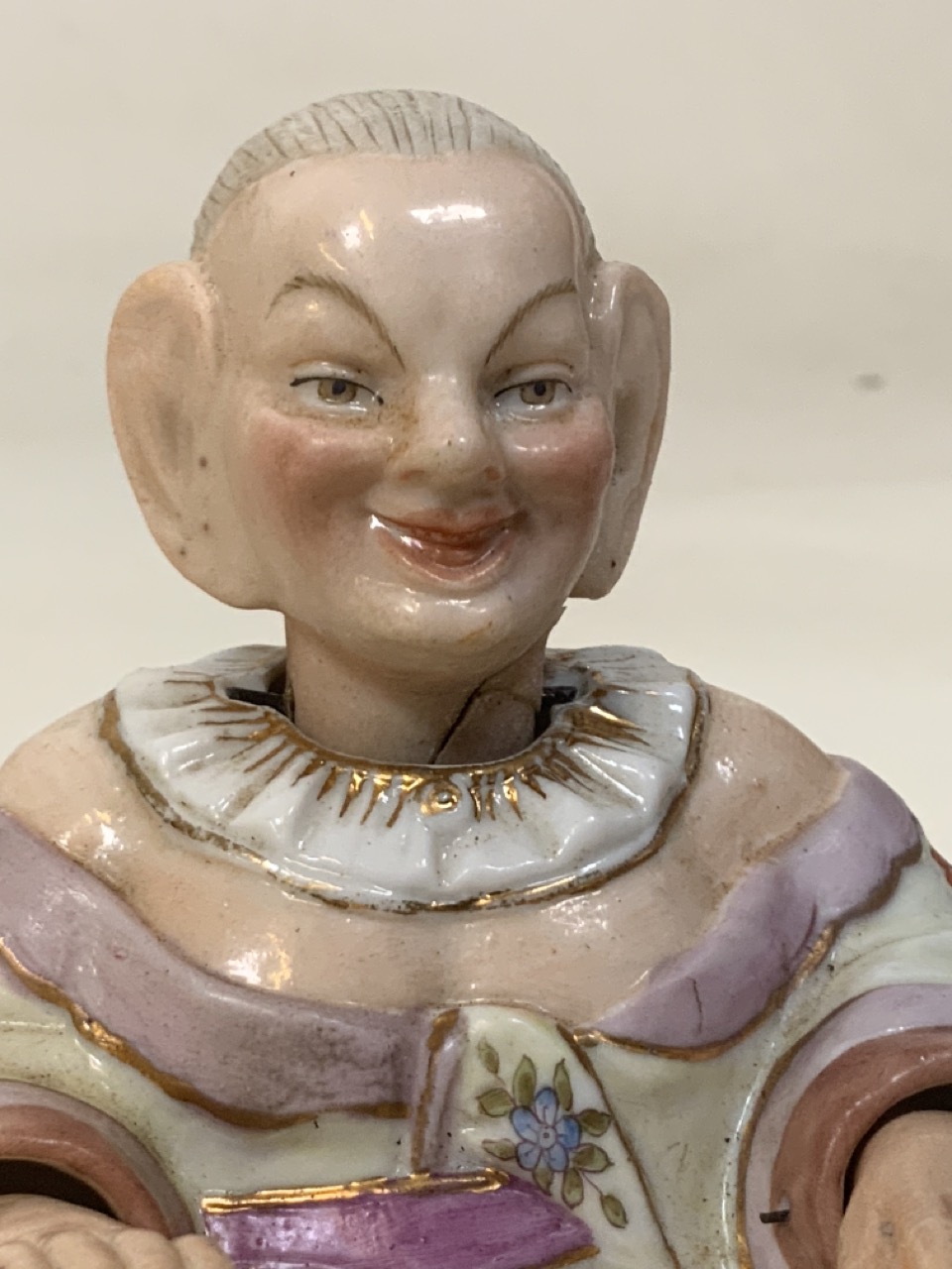 A 19th century porcelain Mandarin nodding hands and head figurine with blue factory anchor mark. - Image 2 of 7