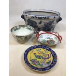 An oriental style blue and white foot bath/planter with other oriental style ceramics