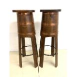 A pair of early 20th century oak coopered plant stands with wrought iron support to base.