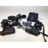 A quantity of cameras and accessories including Sony mini DV video camera, digital Canon Ixus