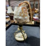 A 19th century grand tour souvenir, Victorian carved cameo conch shell adapted into a light. H:27cm
