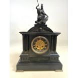 A large slate black and gilt mantle clock with Ionic columns and Greek figural scenes with Statue of