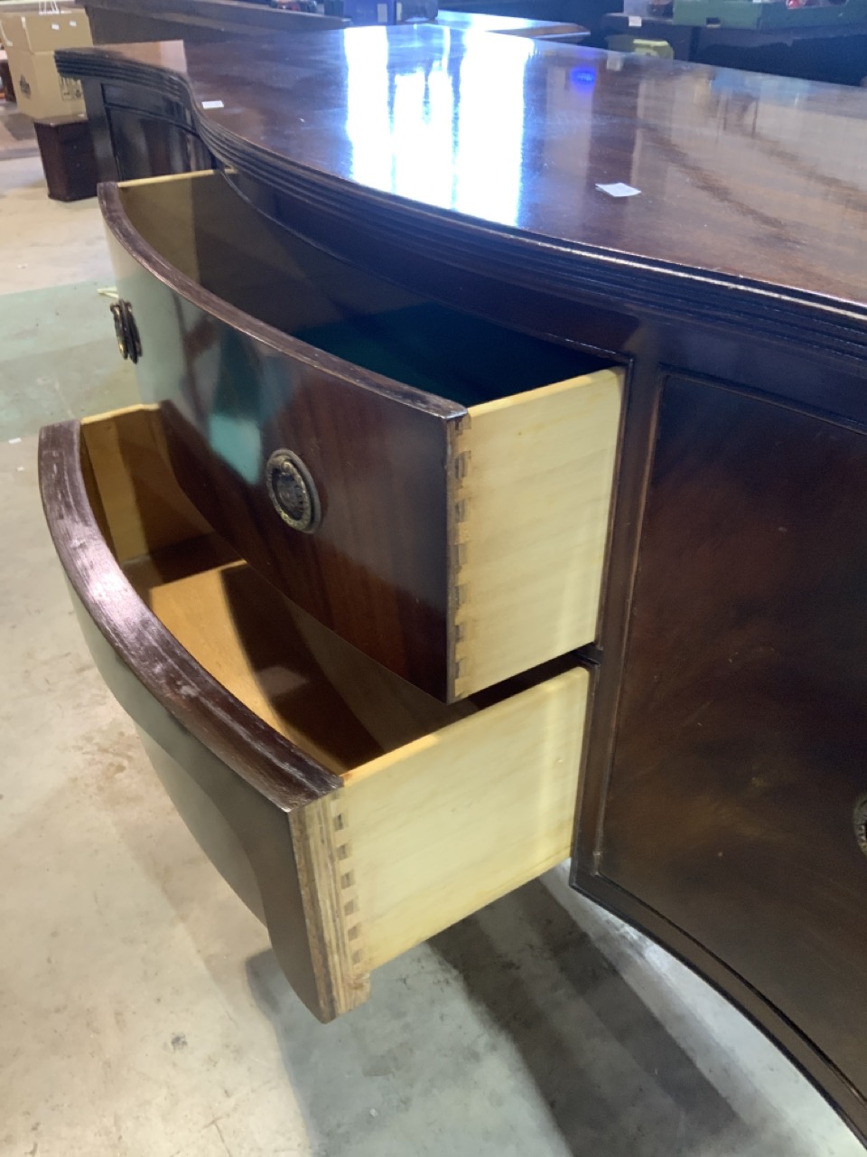 A serpentine fronted sideboard, 20th century, two middle drawers flanked by cupboards. W:141cm x D: - Image 3 of 3