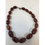 A vintage Amber necklace of graduated beads. Length 46cm