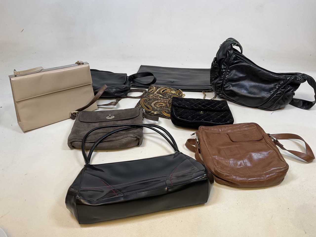 A quantity of designer handbags including Pravda, Salvatore Feragamo, Bruno Magli Enny and others