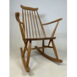 A Small Ercol blonde wood rocker. Seat height H:38cm