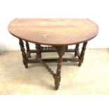 A 19th century oak gate leg table. Extended W:125cm x D:120cm x H:74cm