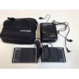 A Sony Walkman with speakers in case. Untested. Also with a pair of Tesco binoculars 16 x 50