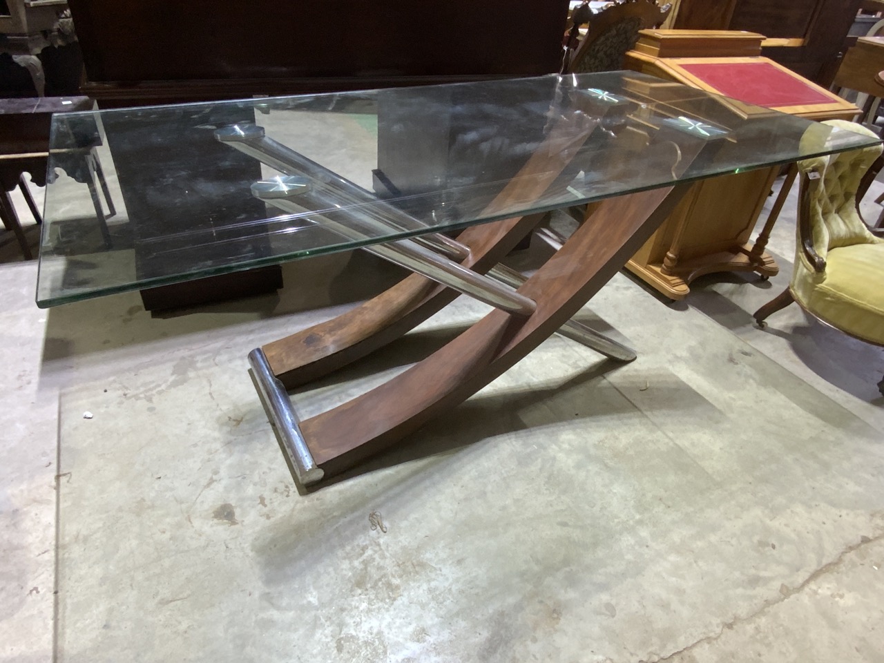 A contemporary designer style glass topped table. 180cm x 90cm x height 73cm.