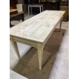 A rustic pine three plank dining table with distressed paintwork and fluted legs. (with 9 inch +