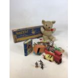 A vintage teddy bear, Chad Valley Christmas money box designed as Happy Days book, Chad Valley