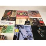 A box of LPs including Bill Hayley, Tom Waits, Manfred Mann, Paul Simon, Lulu, Fairport Convention