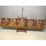 A hand carved and painted decorative panel depicting Asian deities W:126cm x H:30cm