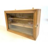 An antique pine glazed small display showcase for the wall with two small interior shelves. W:46cm x