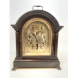 A Large wooden mantle clock marked Junghams Wurttemberg b21 inside. With silvered face.