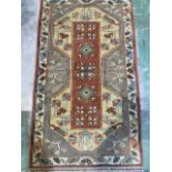 A small vintage Turkish Milas rug W:150cm x D:82cm x