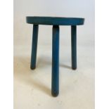 A vintage three legged stool height 35 cm.