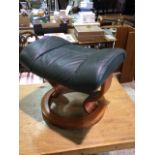 An Ekornes leather foot stool, made in Norway