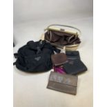 Two Prada handbags - well used - with a quantity of wallets