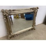 A modern silvered mirror, decorative with bevelled edge. W:96cm x H:74cm