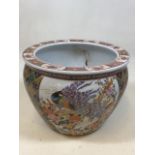 A Chinese porcelain fish bowl with peacock design. Marked to base Made in China W:32cm x H:23cm