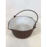 A cast iron bowl with white enamelled inside W:38cm x H:17cm