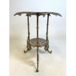 An Italian ornate pierced brass two tier table marked MOD BREVATTATO (patent pending) underneath.