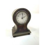 A small early 20th century century brass and tortoiseshell balloon shaped mantle clock. H:9cm