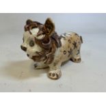 An folk art antique pottery lion. W:29cm x D:12cm x H:17cm