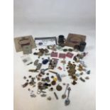 A mixed lot of collectible items including bank notes, coins, lighters, pins, and other items