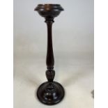 An early 20th century turned candlestick. H:67cm