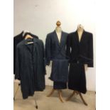 Two Paul Costello suits; navy linen pin stripe trouser suit size 14, black wool trouser suit size