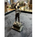A Small bronze statue on marble plinth of a boy with cherries, signed Mobald or Hobald. H:17.5cm
