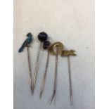 Five Victorian hat/ lapel pins - yellow metal, three set with semi precious stones