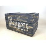 A pine blanket box with hand painted plank effect and blankets lettering. W:80cm x D:49cm x H:47cm