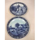 A pair of Boch Belgium Delft wall chargers circa 1960 depicting a winter scene and a horse and