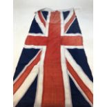 A vintage linen Union Jack flag W:58cm x H:125cm