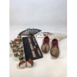 A pair of Turkish slippers, fans an abacus and Japanese spice shakers and others