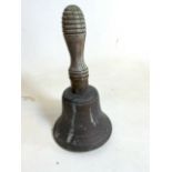 A bronze bell 19th century school bell with wooden turned handle. H:23cm