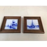 A pair of vintage reclaimed Delft tiles on wooden frames. W:19cm x H:19cm Frame measurements